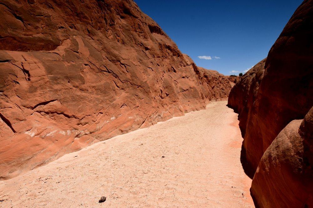 Arroyo, rambla, wadi, and wash - all mean a dry creek, stream bed or gulch that temporarily or seasonally fills and flows after sufficient rain.