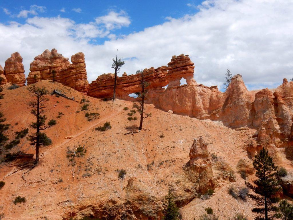 Windowed Wall and Hoodoos above the Waterfall