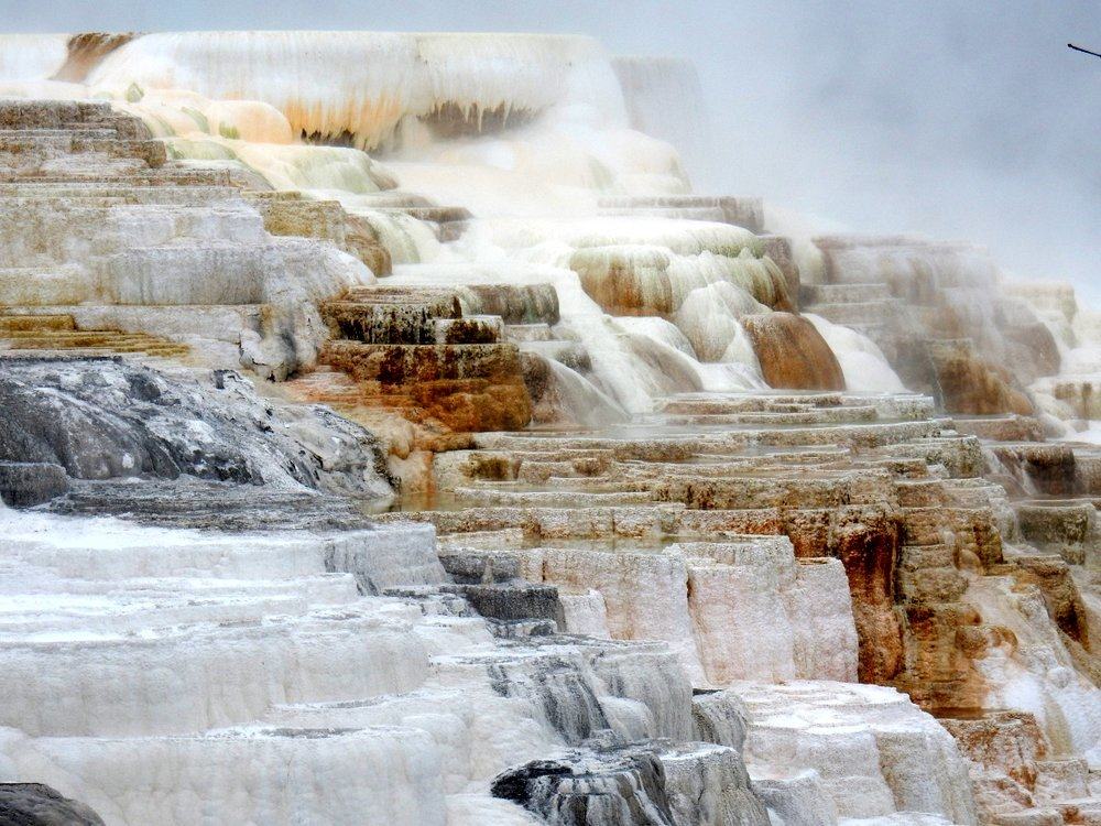 The terraces are made of travertine, a form of limestone deposited by mineral springs, especially hot springs.