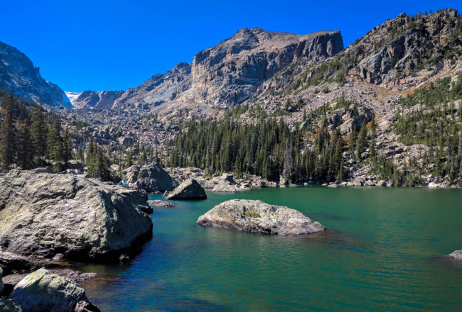 Dotted around shore hikers perch themselves atop huge and small boulders surrounding the lake. We pick a boulder and have our lunch.